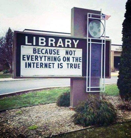 Sign says: Library - Because not everything on the internet is true